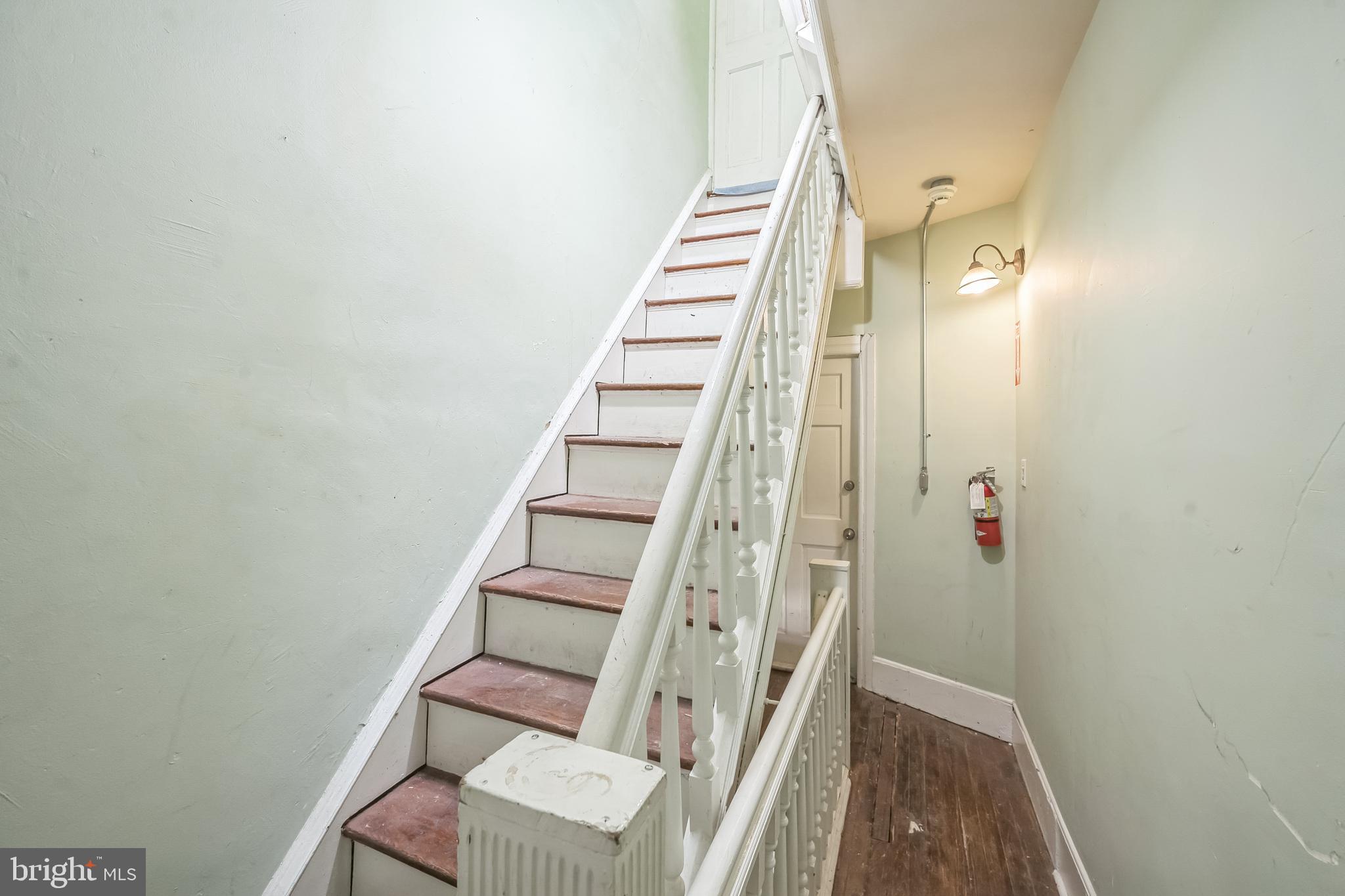 5131 Pine Street Philadelphia, PA 19143 - Photo 12 of 31 a view of entryway with wooden floor and stairs