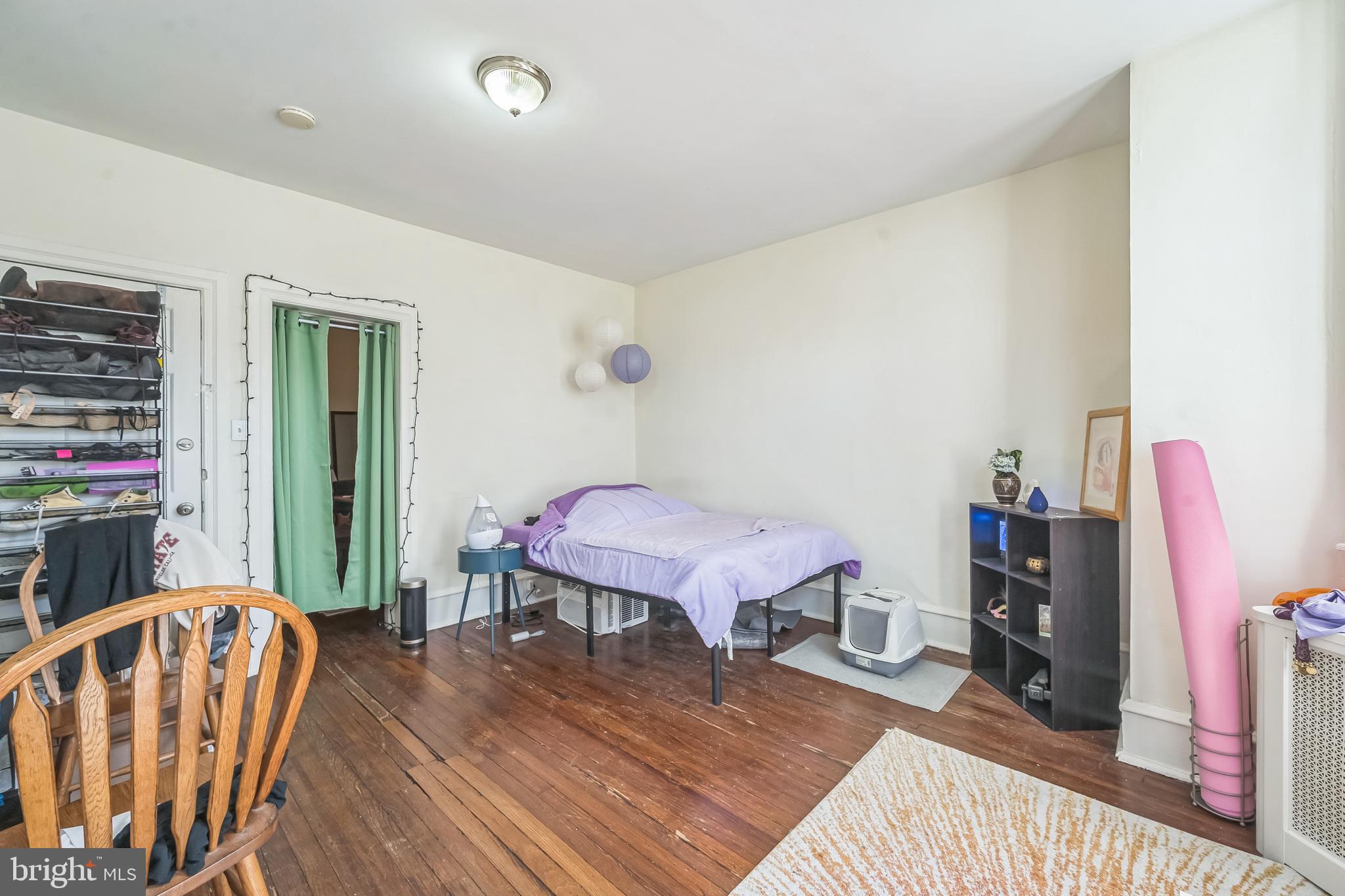 5131 Pine Street Philadelphia, PA 19143 - Photo 21 of 31 a bedroom with furniture and a wooden floor