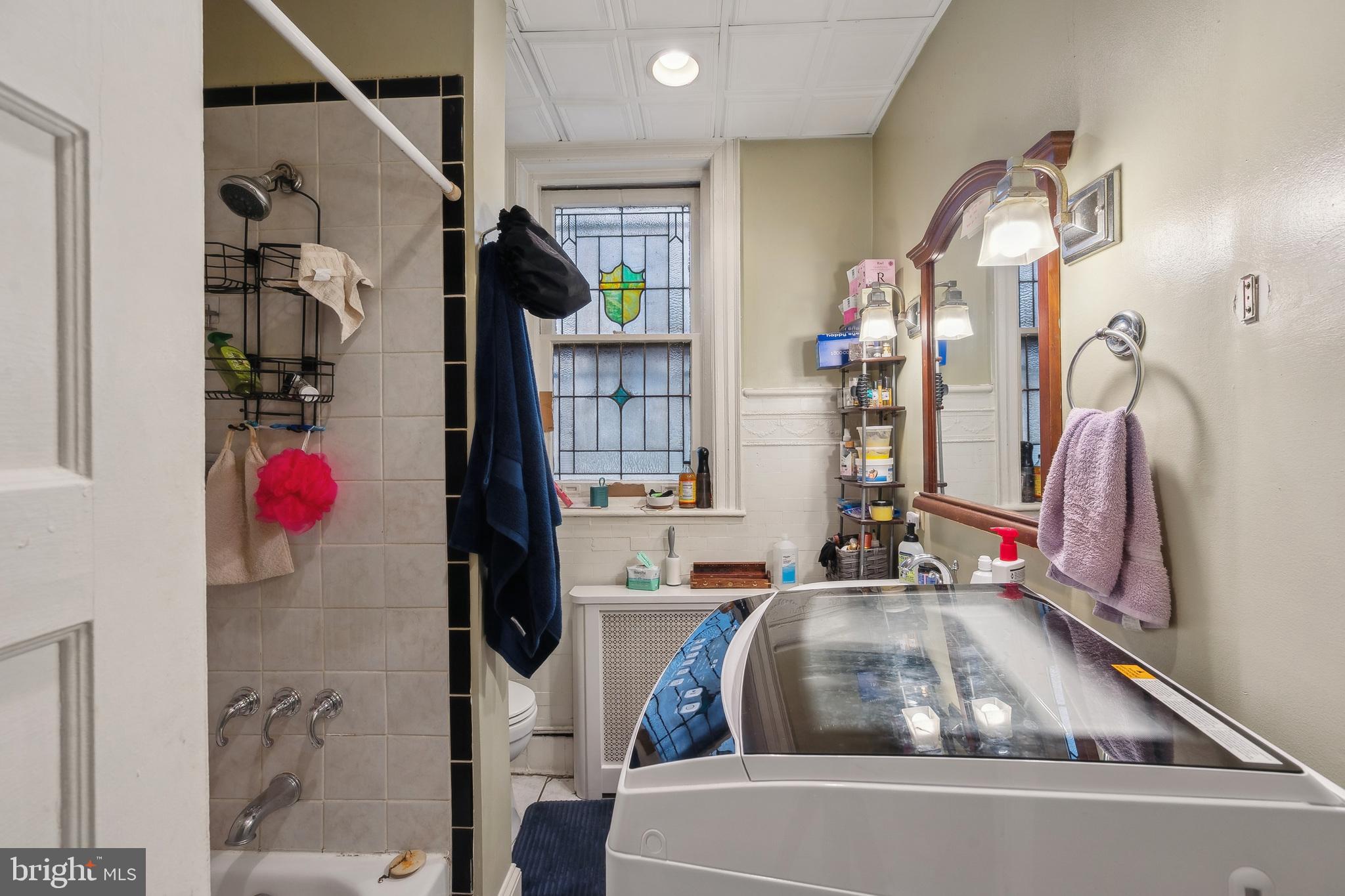 5131 Pine Street Philadelphia, PA 19143 - Photo 22 of 31 a living room with furniture and a floor to ceiling window