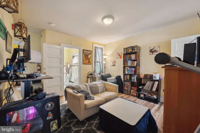 a kitchen with refrigerator and cabinets
