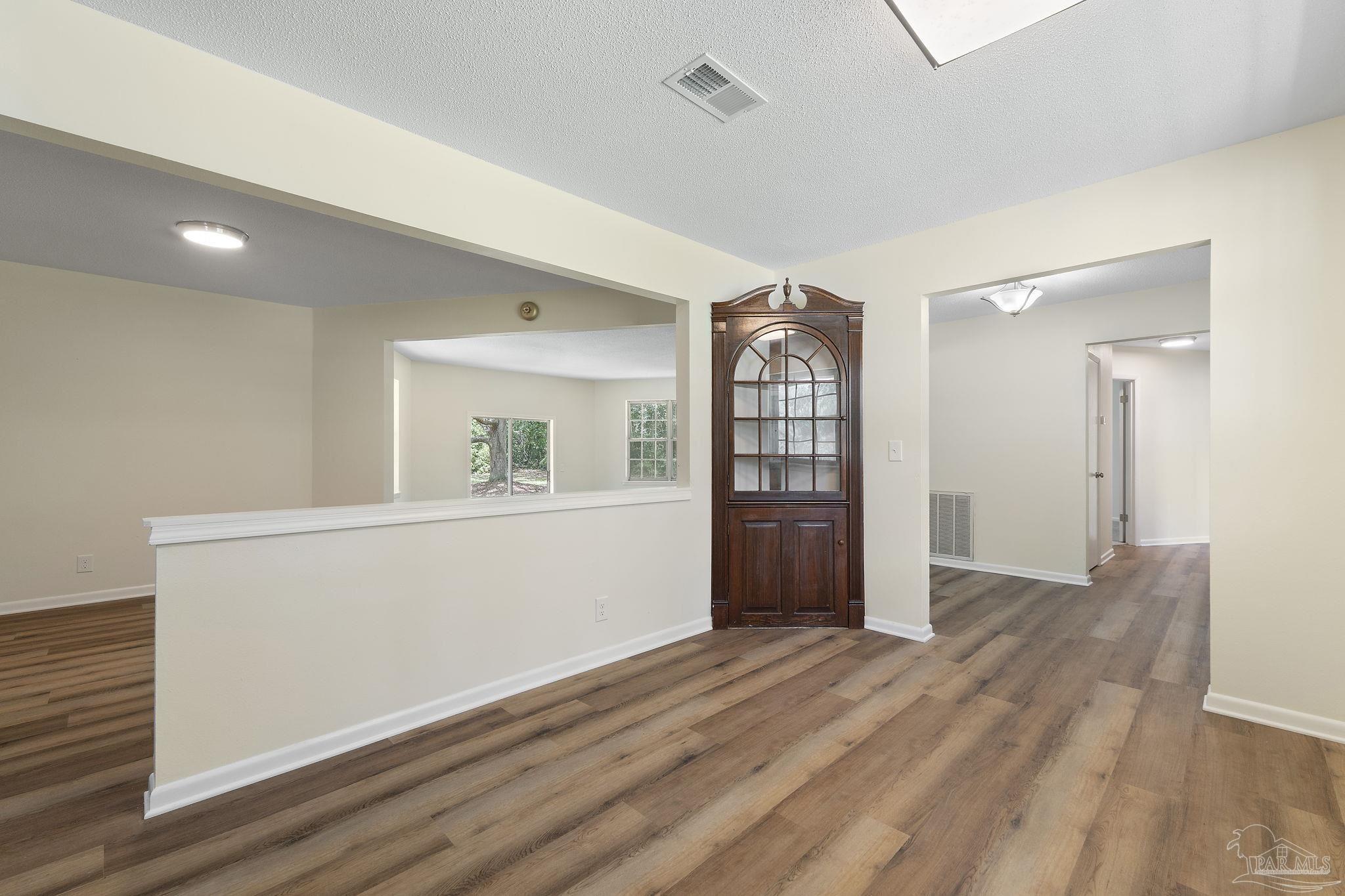6472 Sandy Lane Milton, FL 32570 - Photo 13 of 51 a view of livingroom with hardwood
