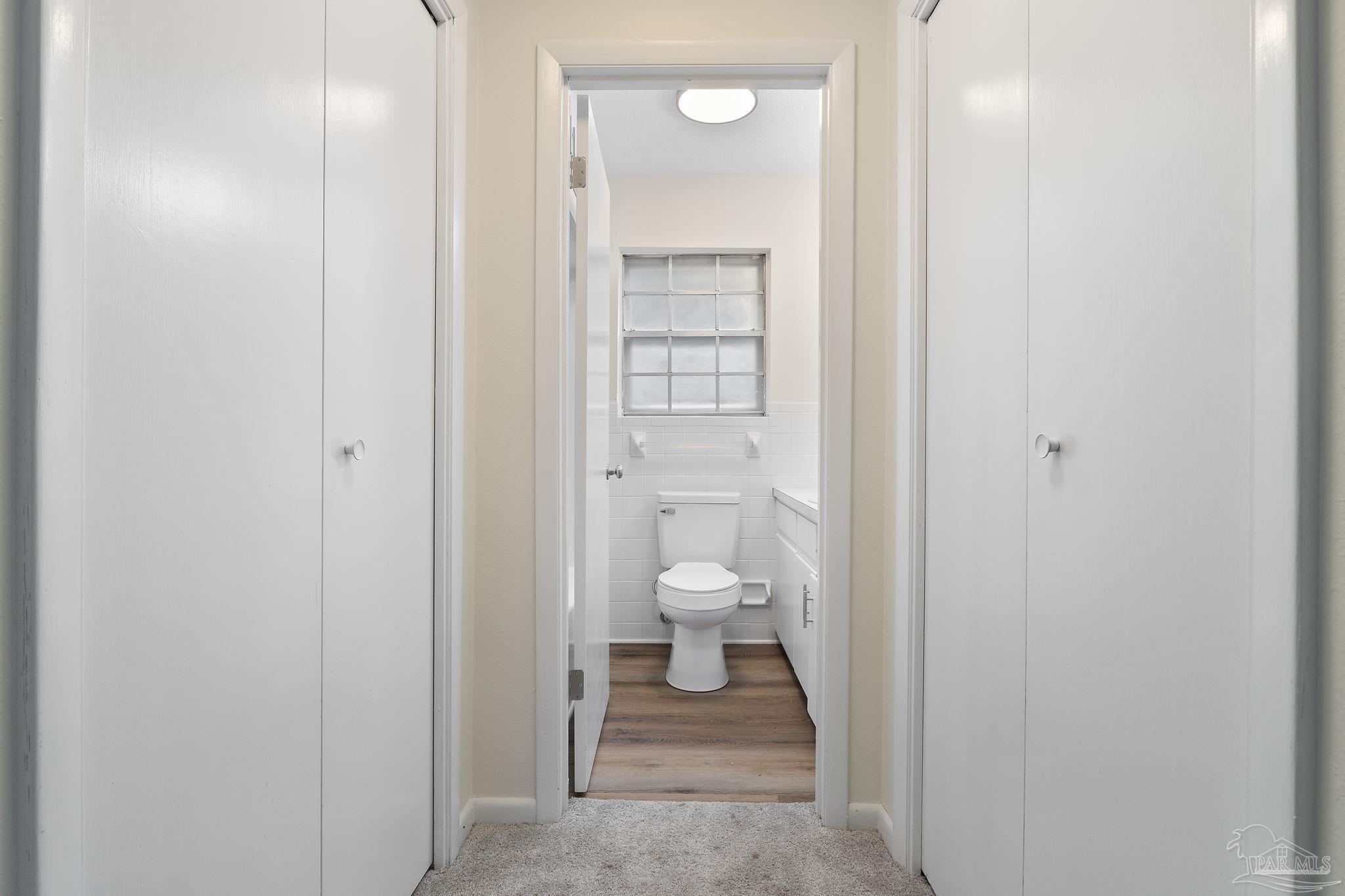 6472 Sandy Lane Milton, FL 32570 - Photo 21 of 51 a bathroom with a toilet