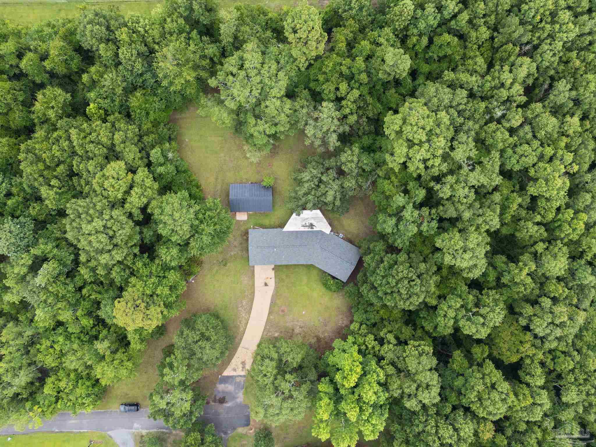 6472 Sandy Lane Milton, FL 32570 - Photo 41 of 51 an aerial view of a house with a yard