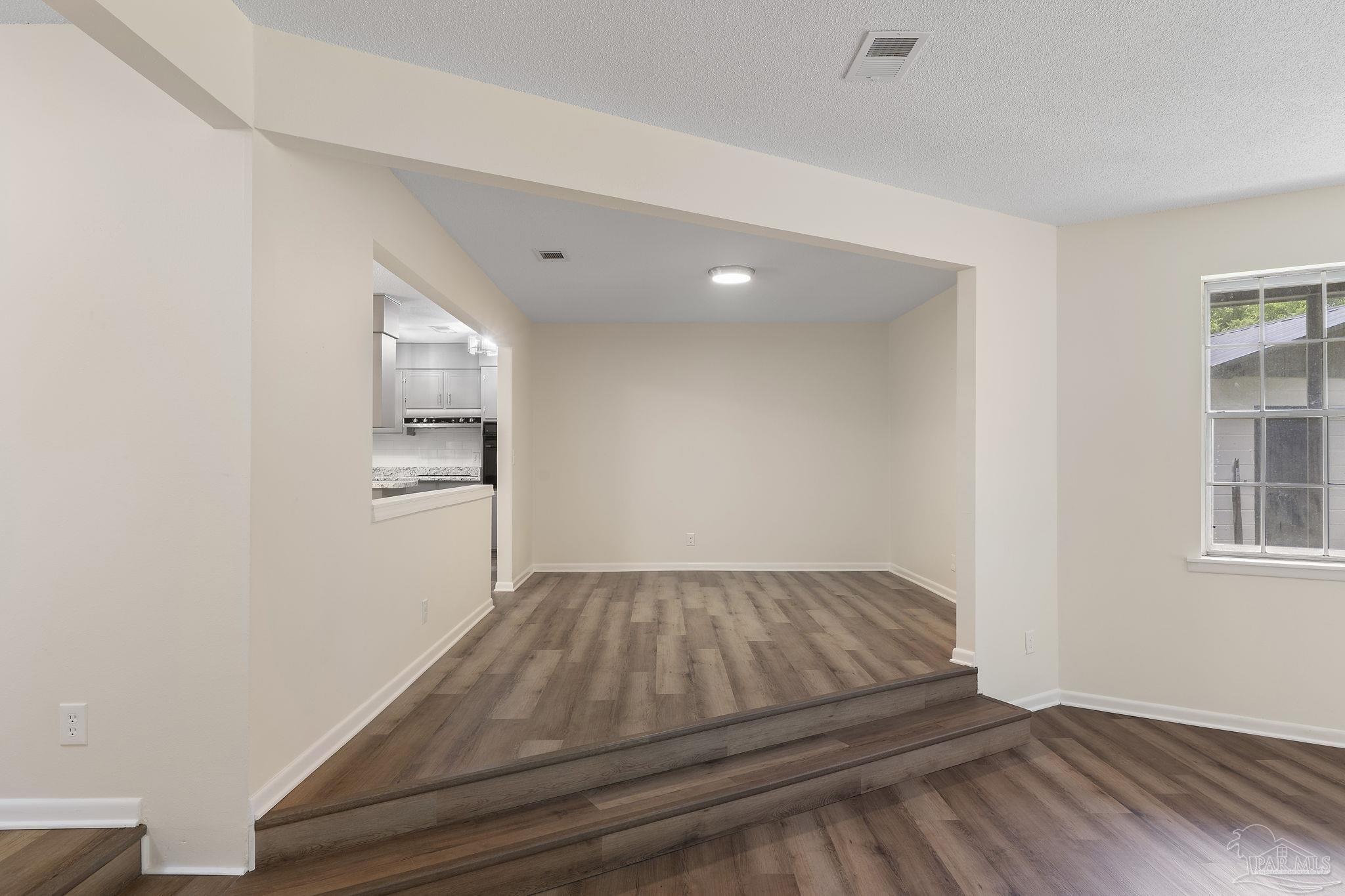 6472 Sandy Lane Milton, FL 32570 - Photo 8 of 51 an empty room with windows