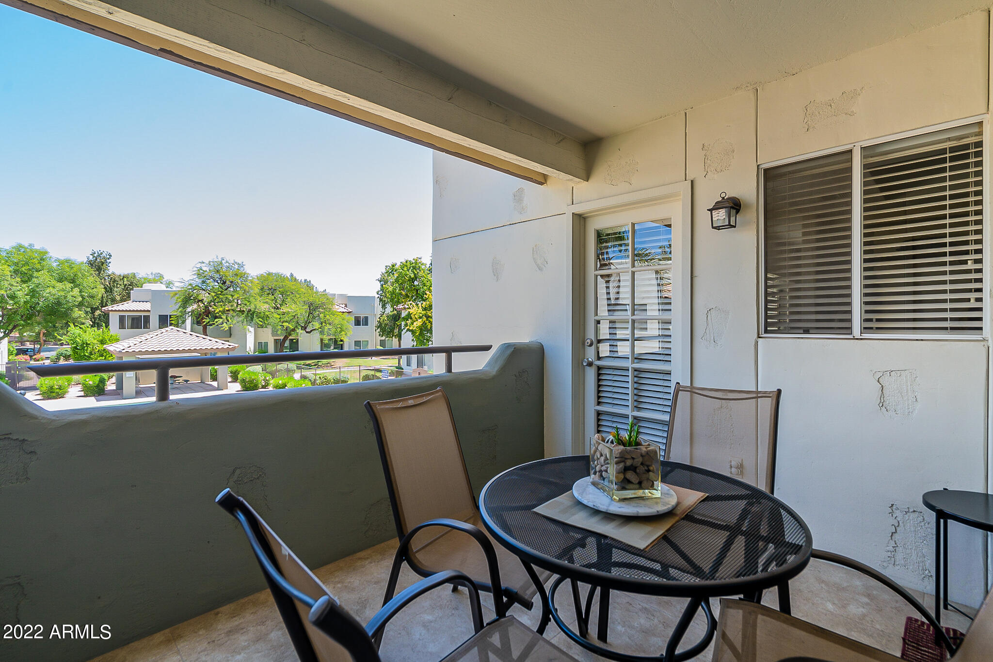 1825 West Ray Road, Unit 2050 Chandler, AZ 85224 - Photo 23 of 26 Patio overlooks pool