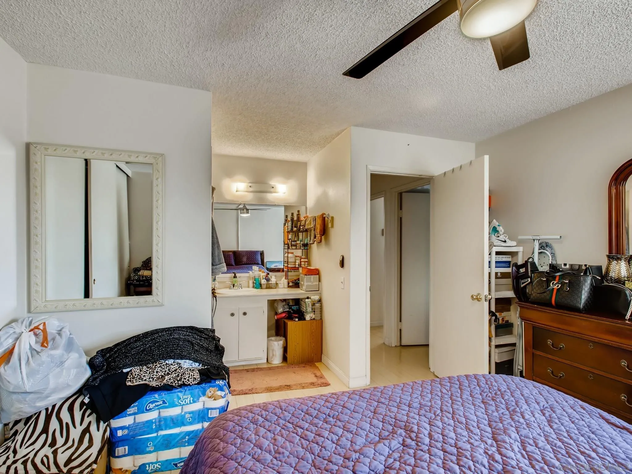 3550 Ruffin Road, Unit 239 San Diego, CA 92123 - Photo 16 of 27 a bedroom with a bed and furniture