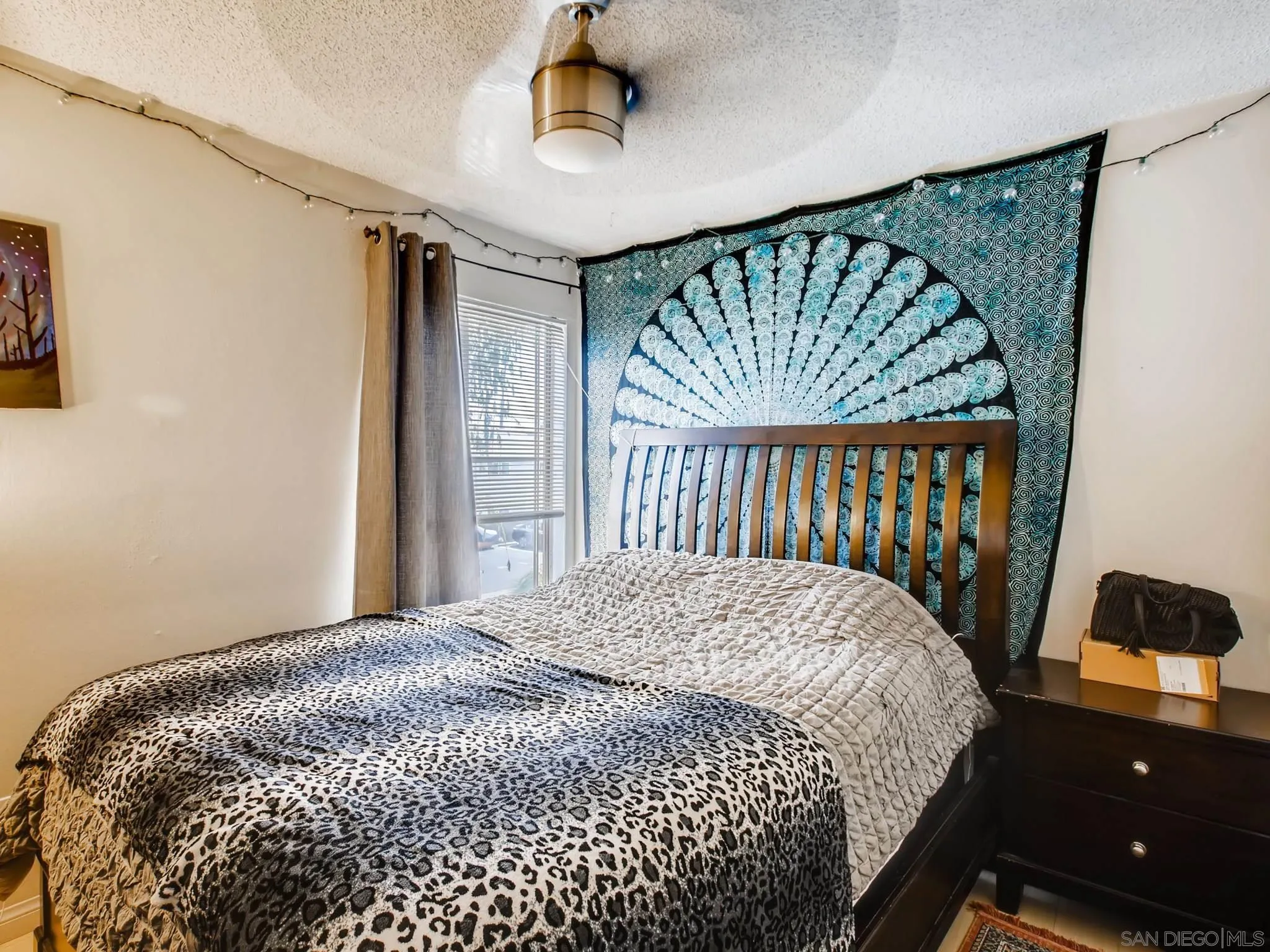 3550 Ruffin Road, Unit 239 San Diego, CA 92123 - Photo 19 of 27 a bedroom with a bed and a window