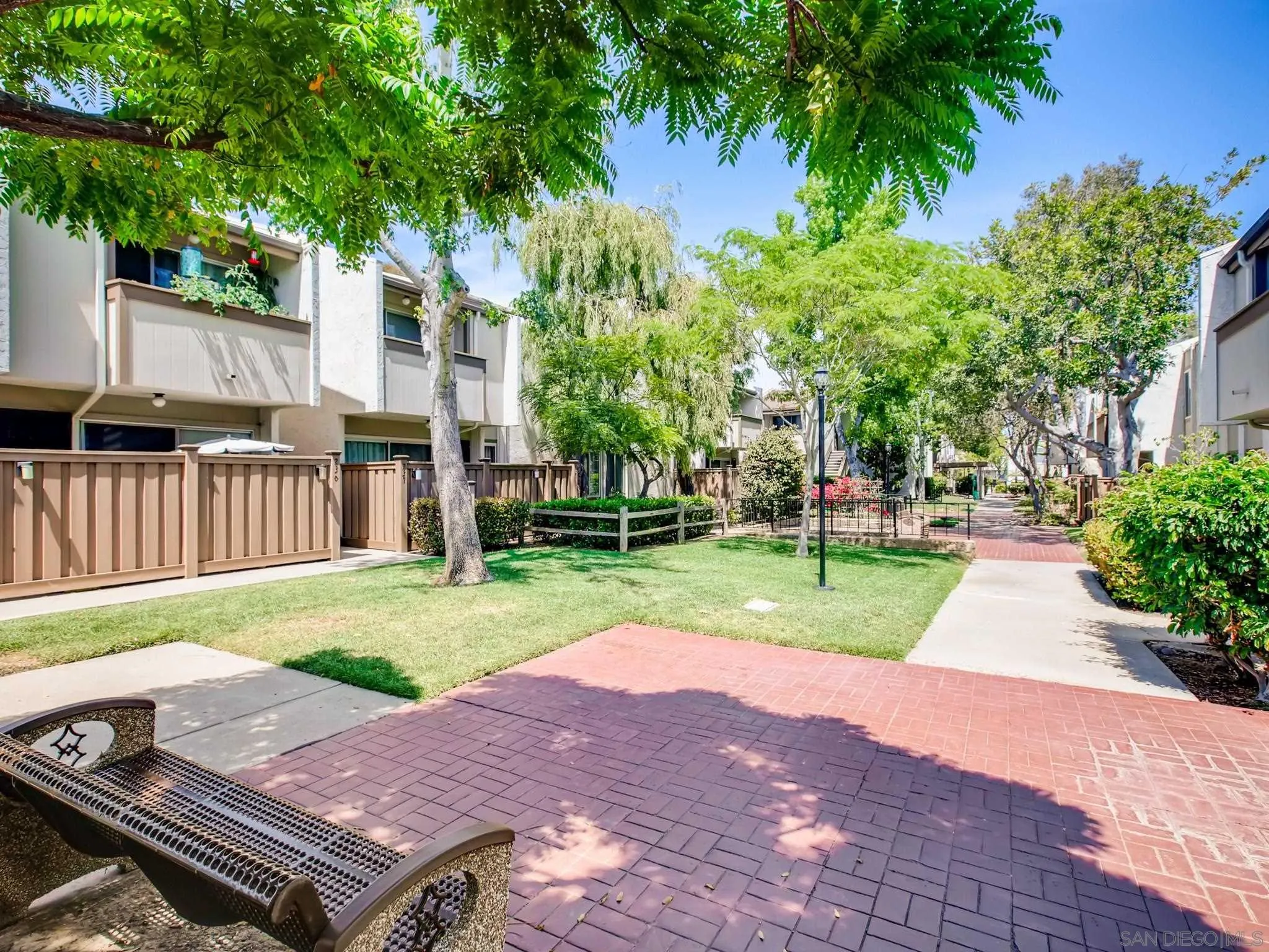 3550 Ruffin Road, Unit 239 San Diego, CA 92123 - Photo 24 of 27 a view of a patio with a yard