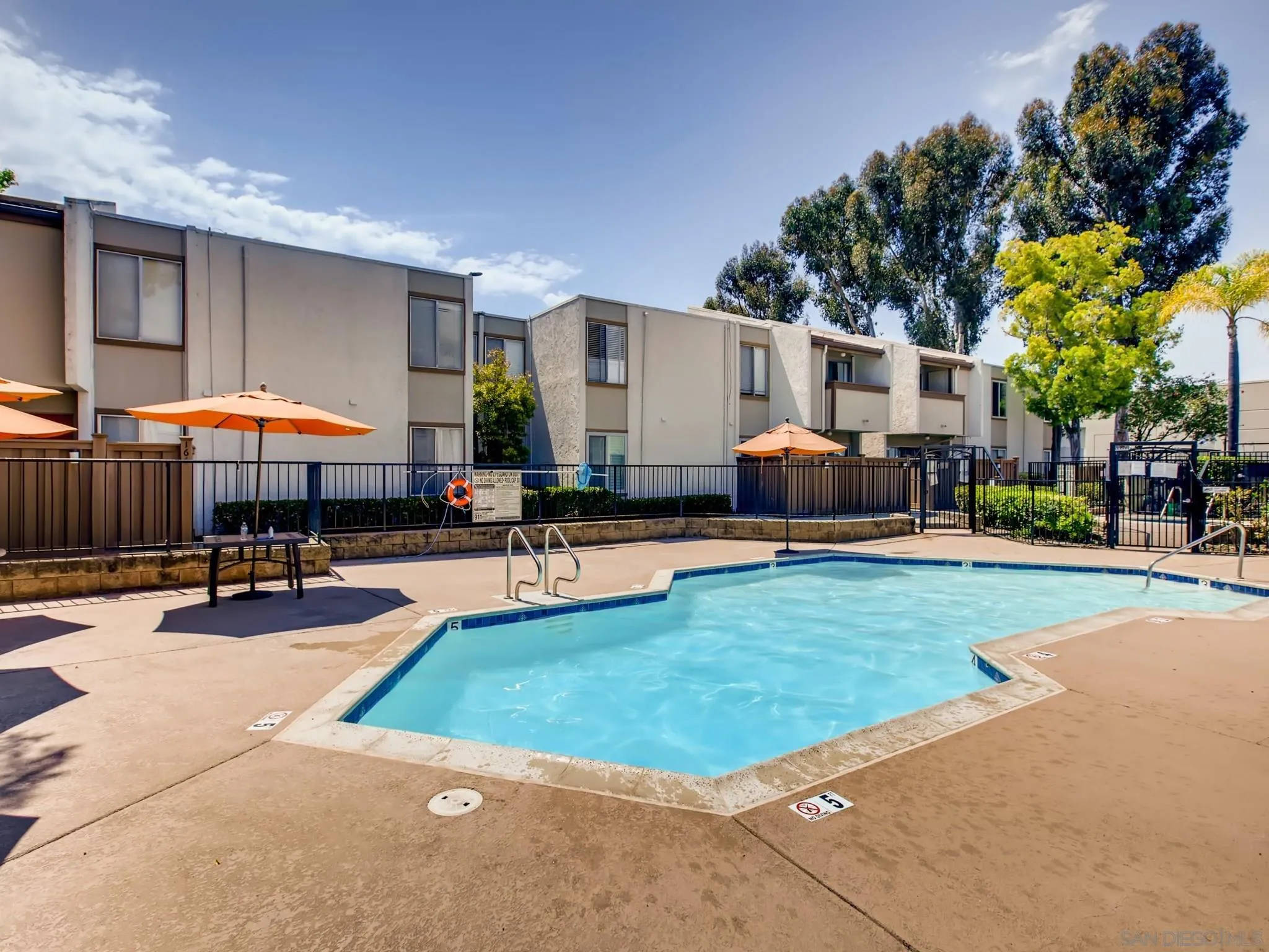 3550 Ruffin Road, Unit 239 San Diego, CA 92123 - Photo 25 of 27 a swimming pool with outdoor seating yard and patio