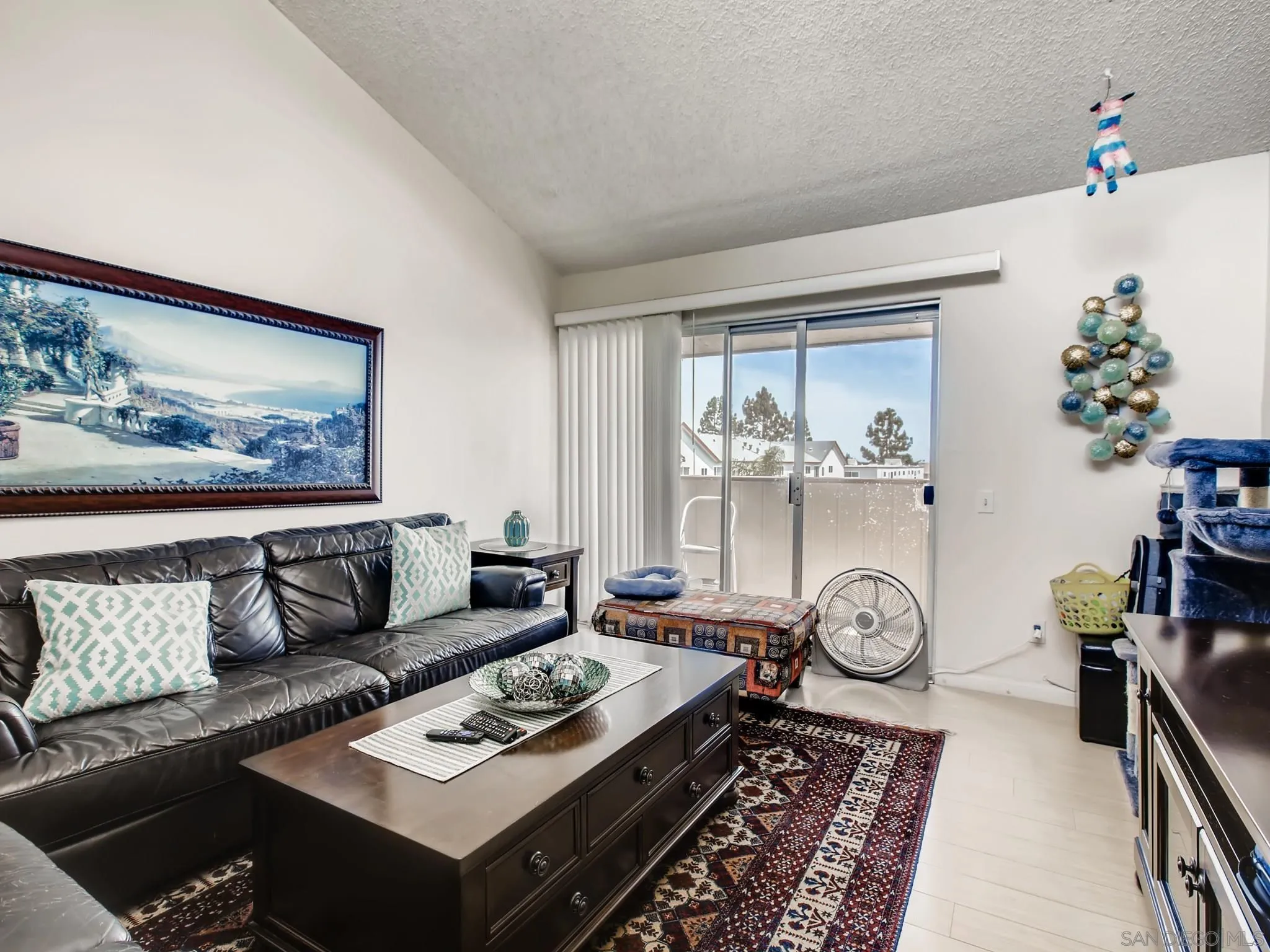 3550 Ruffin Road, Unit 239 San Diego, CA 92123 - Photo 6 of 27 a living room with furniture and wooden floor