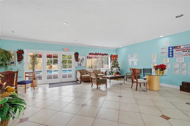 a living room with furniture a rug and a space