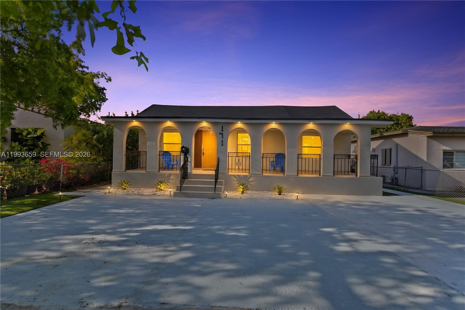 a view of swimming pool with a building in the background
