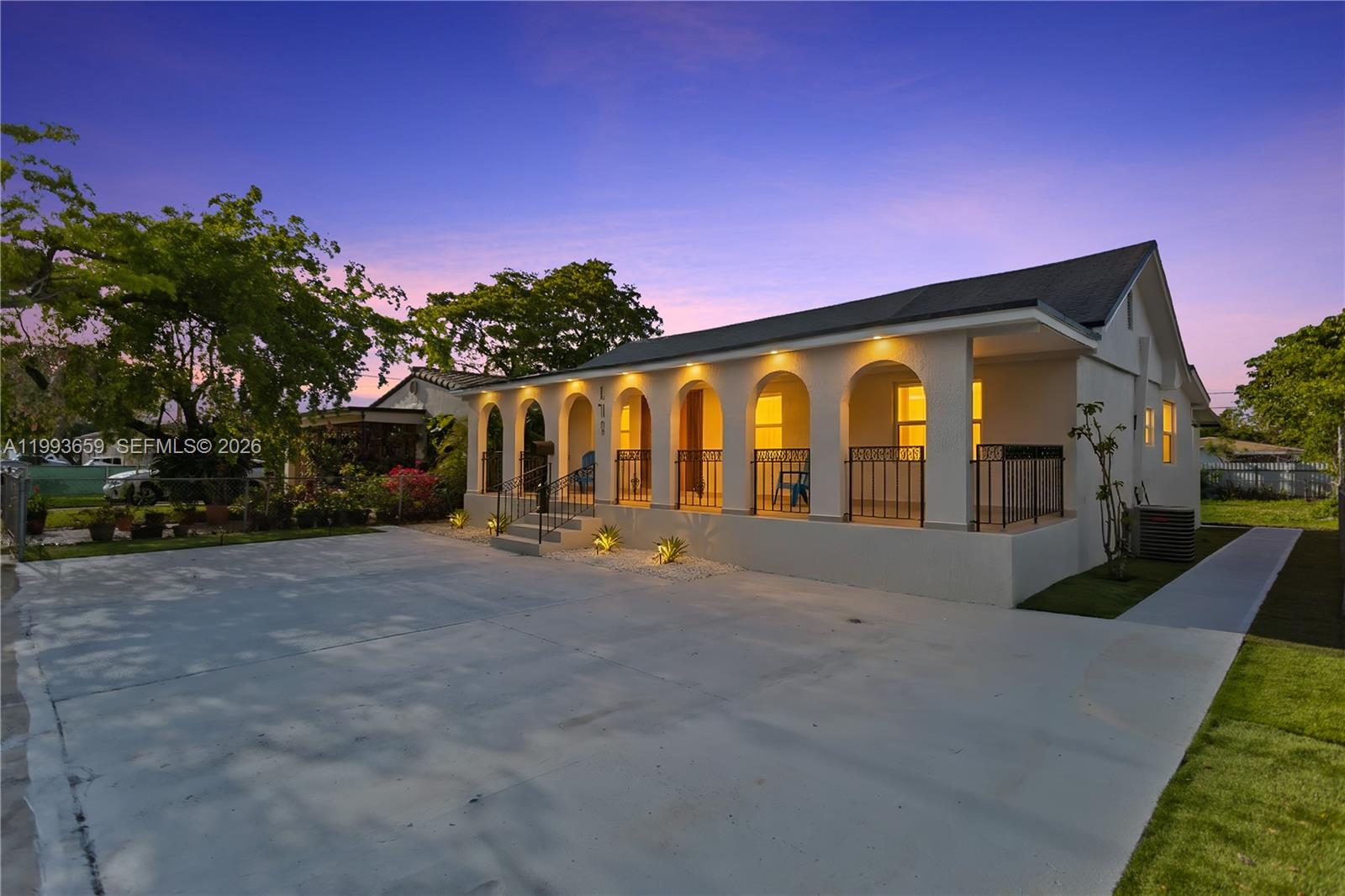 171 West 13th Street Hialeah, FL 33010 - Photo 2 of 84 a view of a house with backyard and trees
