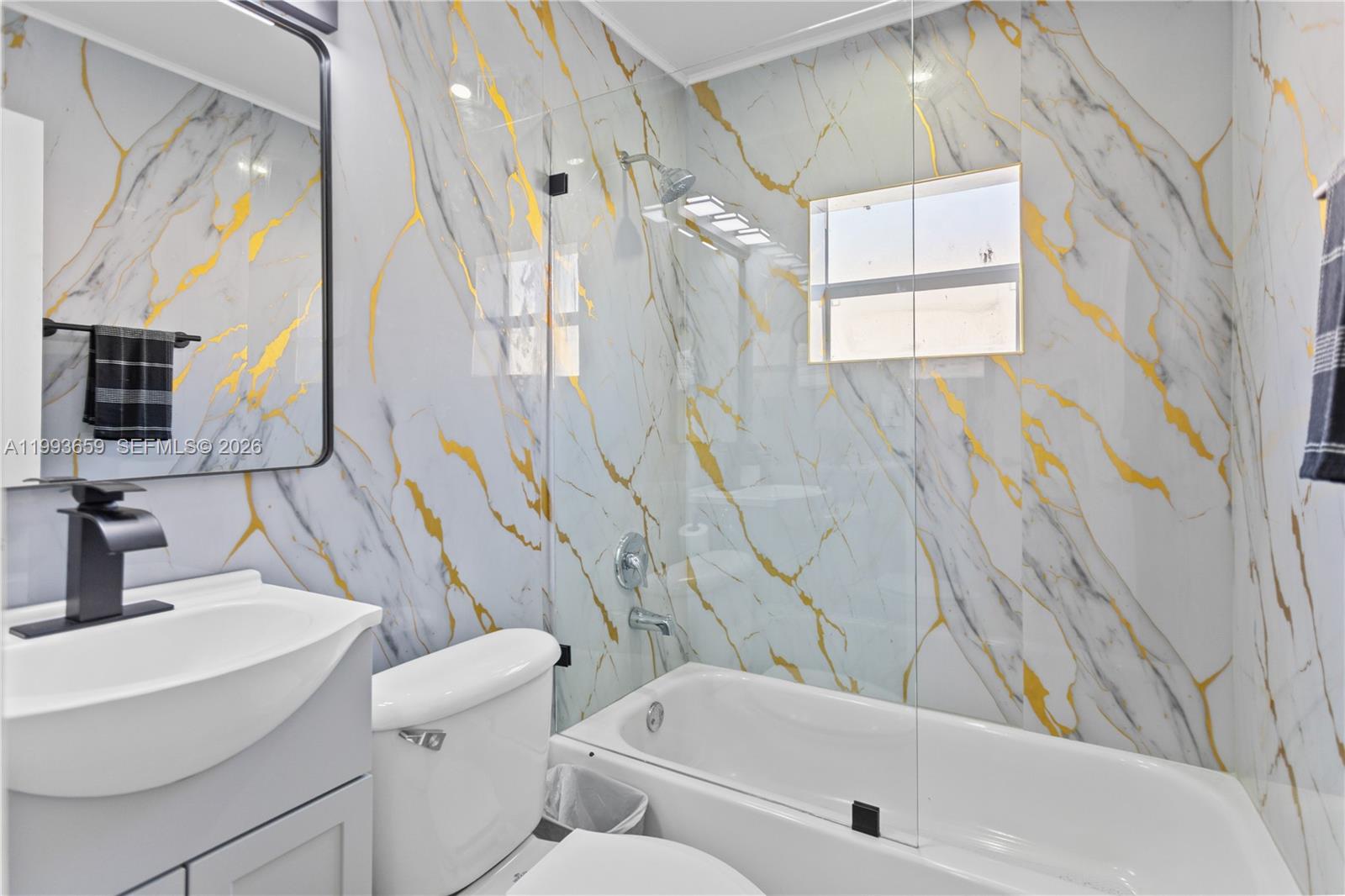 171 West 13th Street Hialeah, FL 33010 - Photo 31 of 84 a bathroom with a sink toilet and shower