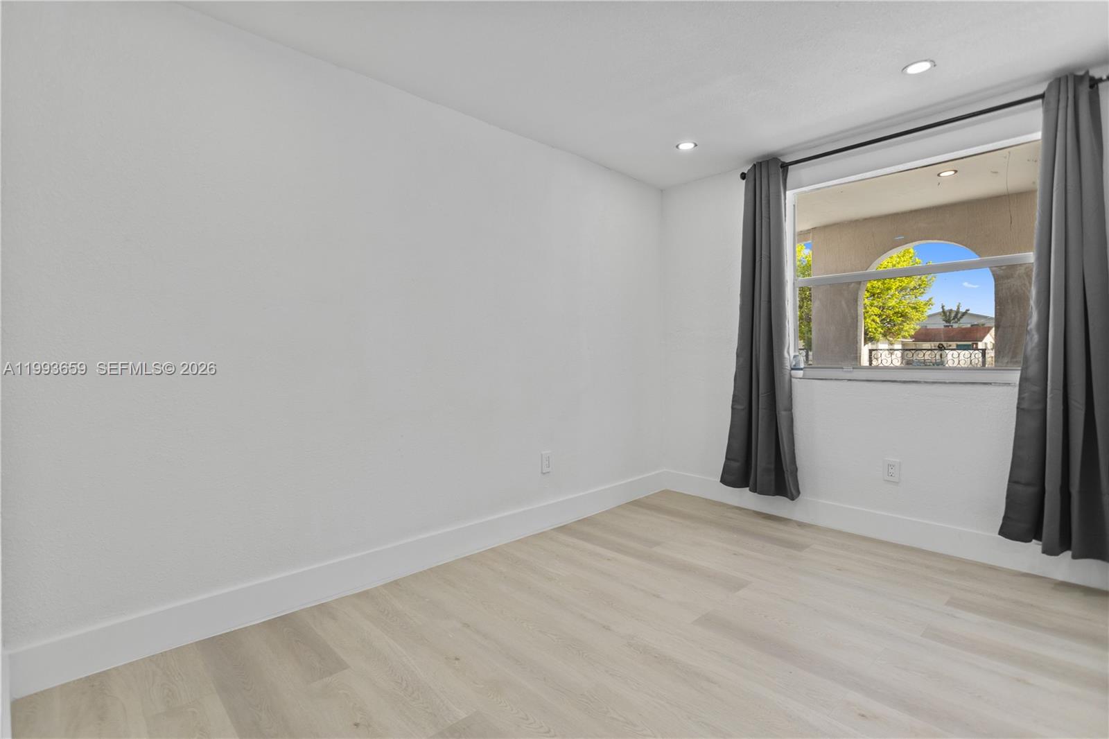 171 West 13th Street Hialeah, FL 33010 - Photo 33 of 84 a view of an empty room with a window