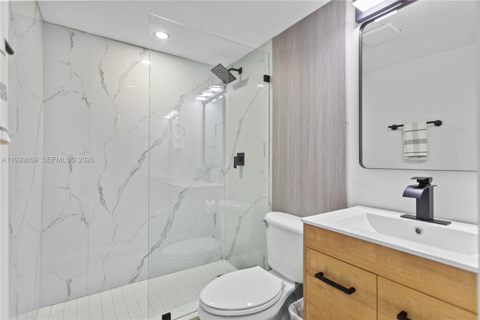 171 West 13th Street Hialeah, FL 33010 - Photo 45 of 84 a bathroom with a sink toilet and shower