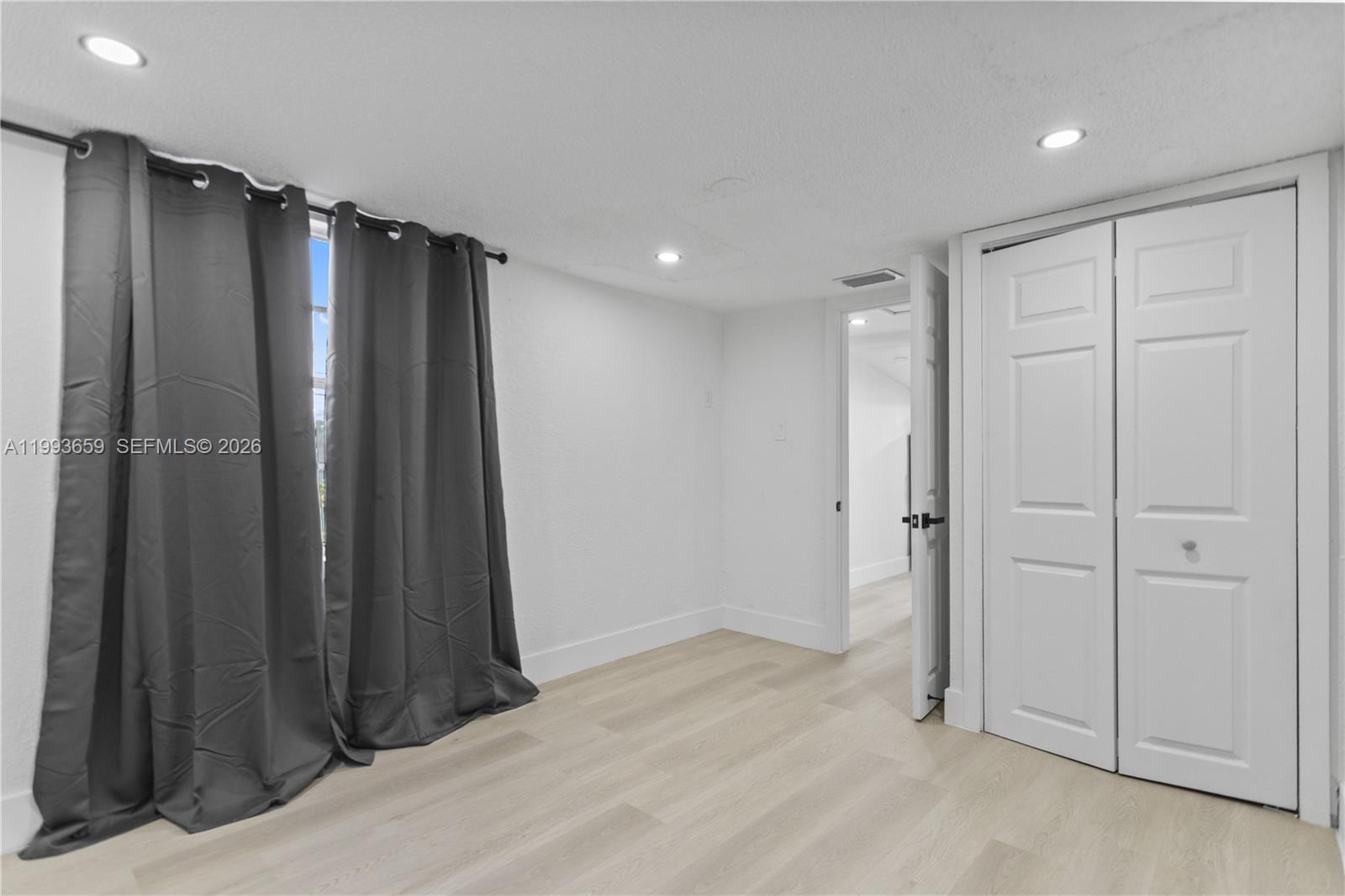 171 West 13th Street Hialeah, FL 33010 - Photo 50 of 84 a view of a hallway with walk in closet