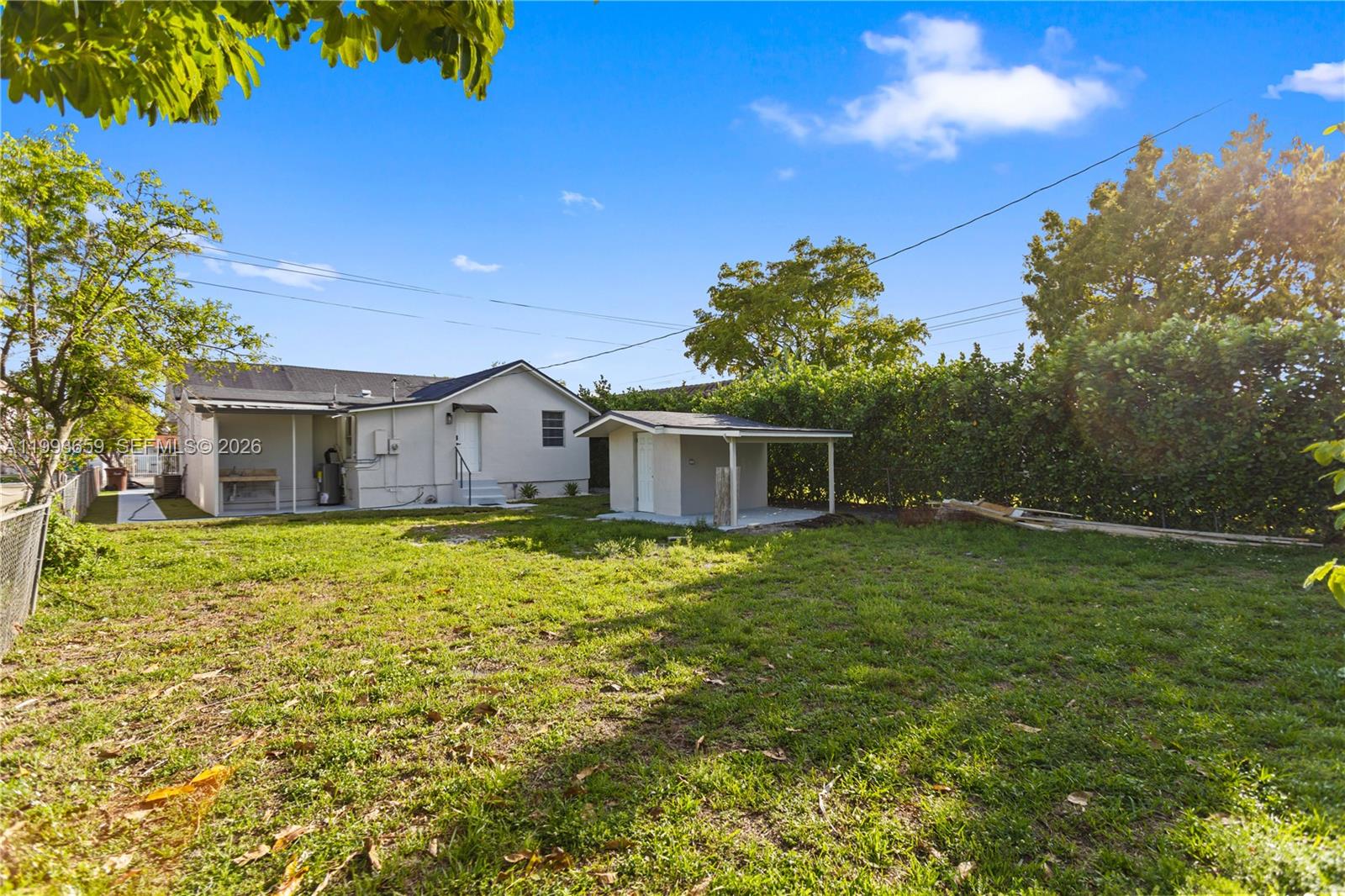 171 West 13th Street Hialeah, FL 33010 - Photo 55 of 84 a front view of a house with a garden