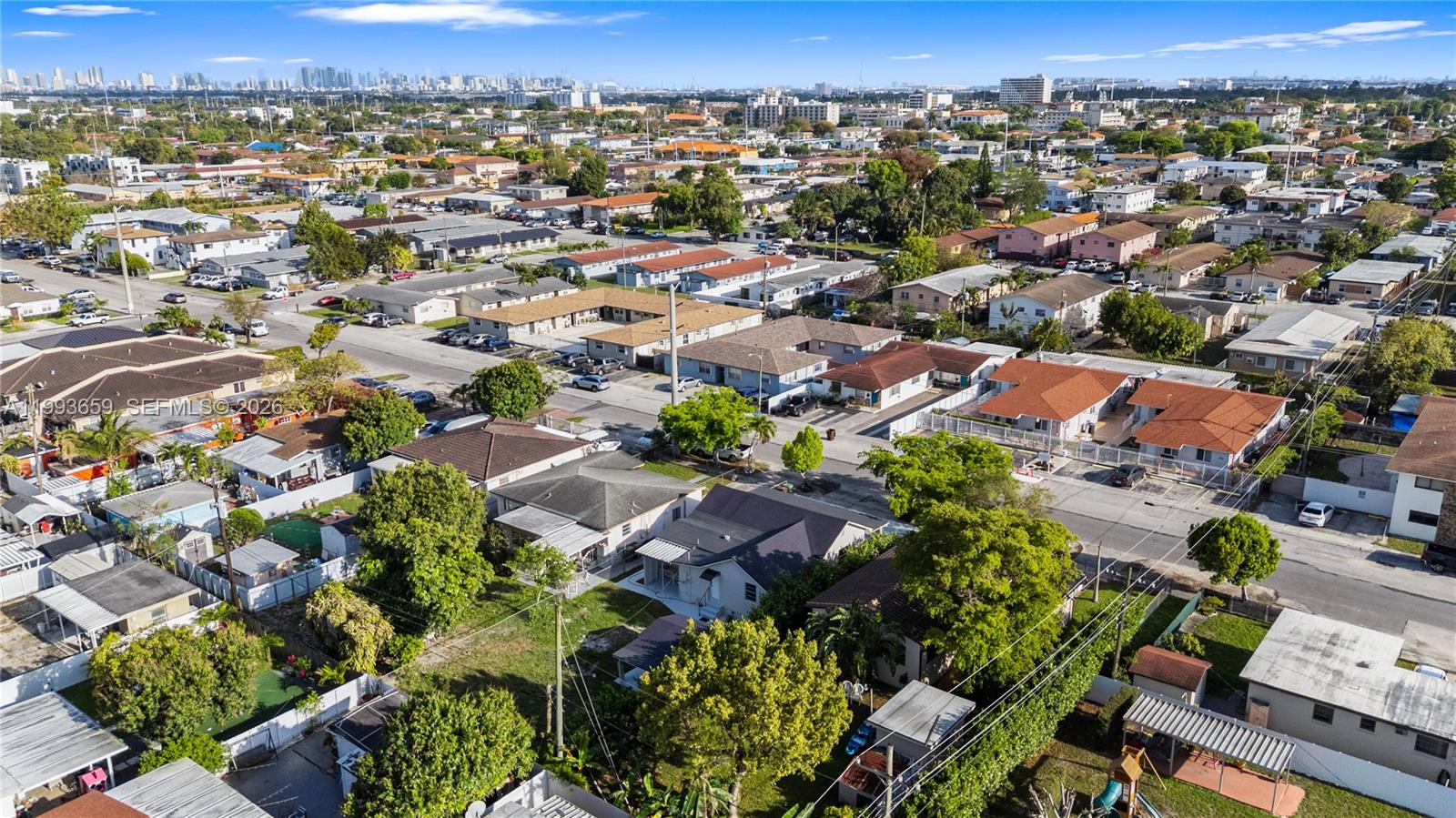 171 West 13th Street Hialeah, FL 33010 - Photo 69 of 84 an aerial view of residential houses with outdoor space and trees