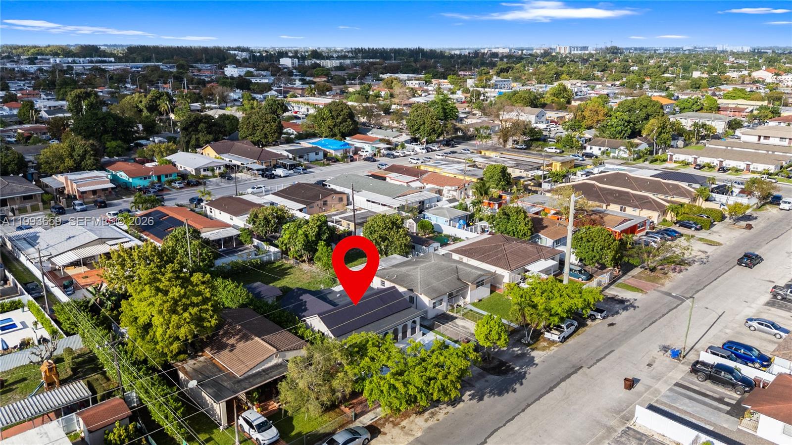 171 West 13th Street Hialeah, FL 33010 - Photo 72 of 84 an aerial view of a houses with a swimming pool