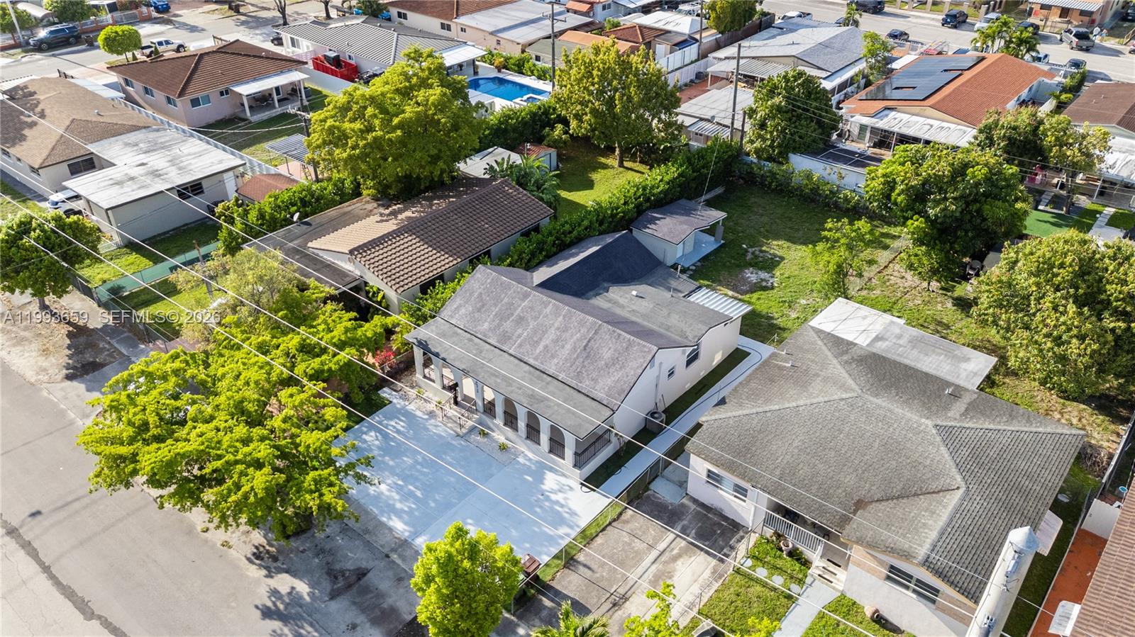 171 West 13th Street Hialeah, FL 33010 - Photo 78 of 84 an aerial view of a house with a yard and garden