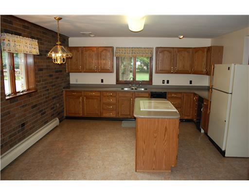 415 Ridge Road Brownsville, PA 15417 - Photo 3 of 22 Kitchen. The spacious kitchen boasts abundant cabinet space with Corian tops.