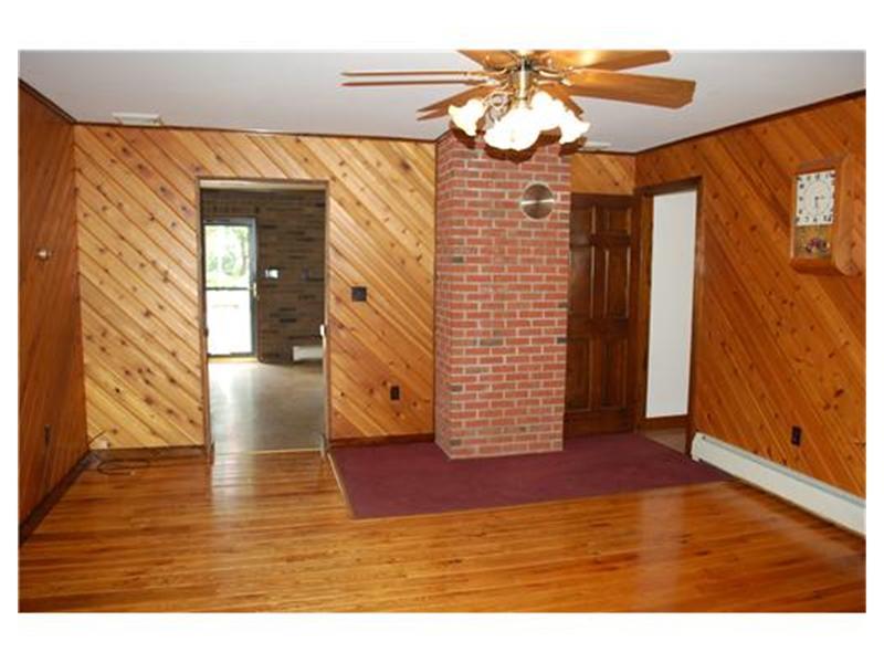 415 Ridge Road Brownsville, PA 15417 - Photo 7 of 22 Master Bedroom. This space can be utilized as the master bedroom with an adjacent full bath. There is access to a private side covered porch.