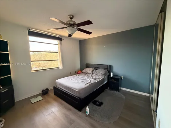 a bed room with a bed and a television