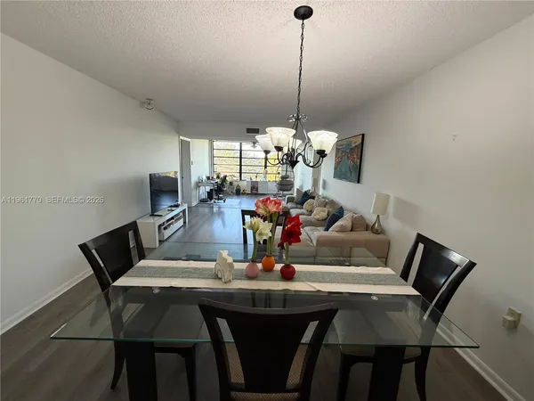 a kitchen with stainless steel appliances granite countertop a sink stove and microwave