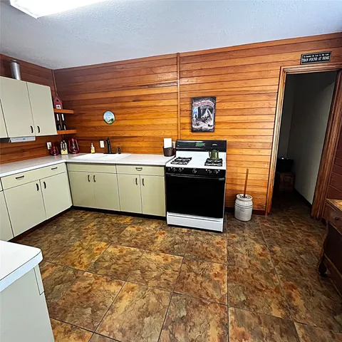 a kitchen with a sink and cabinets