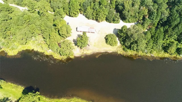 a view of a lake with a yard