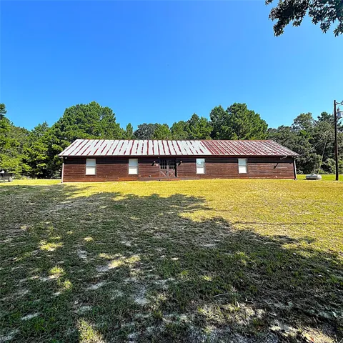 a view of a swimming pool with an outdoor space and seating area