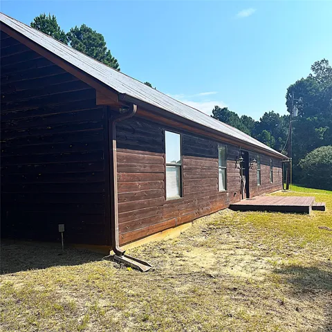 a living room with furniture a wooden floor and chandelier