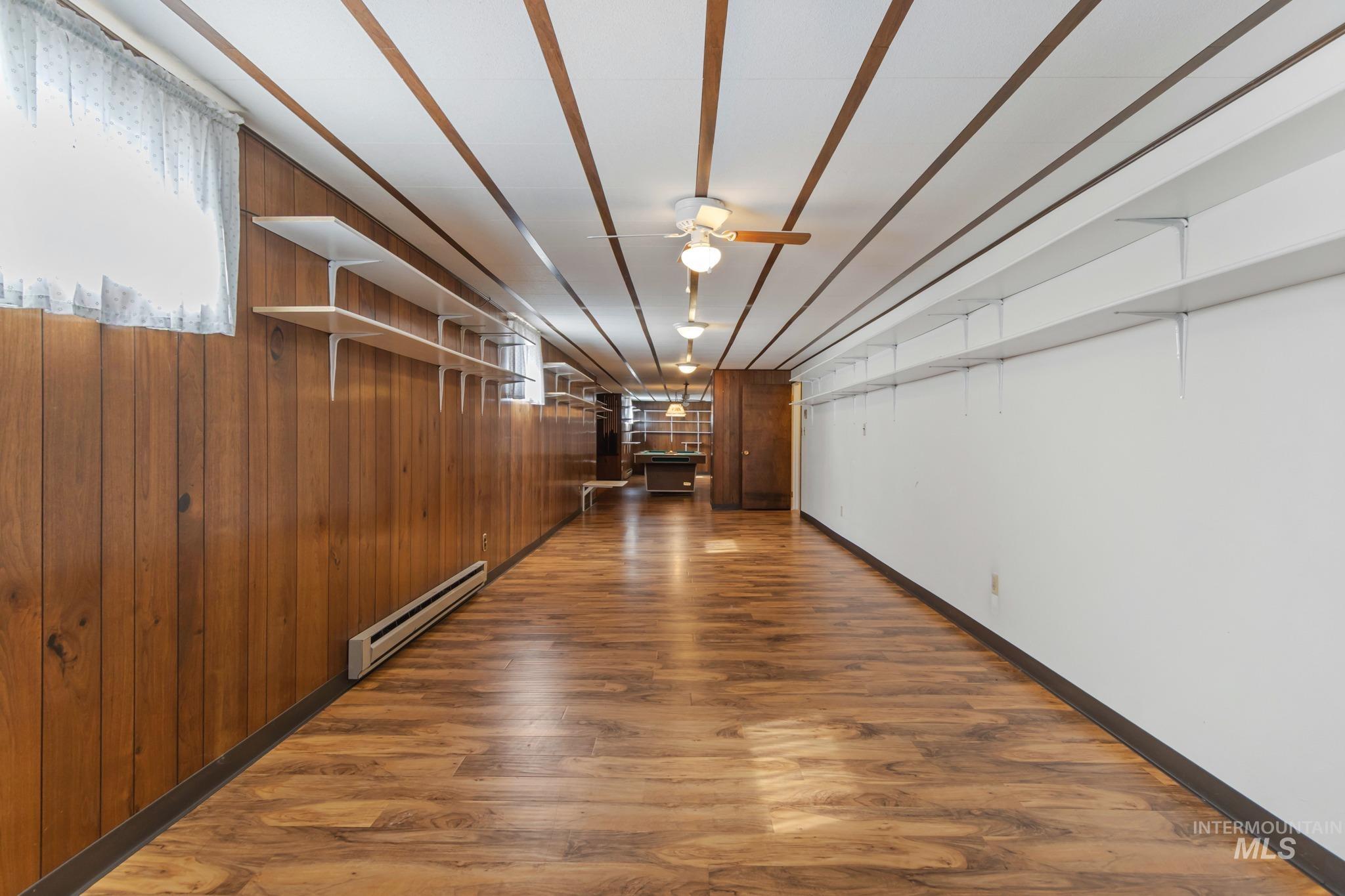 11360 West Lake Hazel Road Boise, ID 83709 - Photo 42 of 50 Carpeted flooring with baseboard heating and overhead lighting