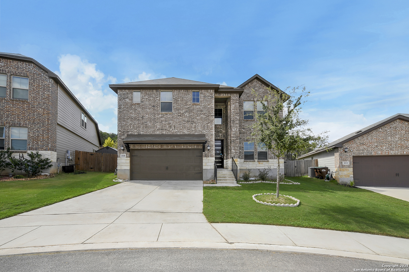 10108 Juniper Oaks Boerne, TX 78006 - Photo 1 of 1 a front view of house with yard and green space