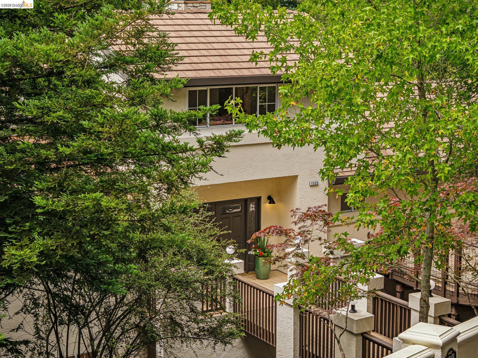 1325 Drury Road Berkeley, CA 94705 - Photo 67 of 71 Stucco exterior featuring a tiled roof and brown-framed windows