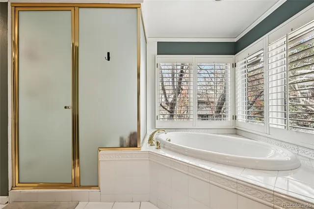 a white bath tub sitting next to a window