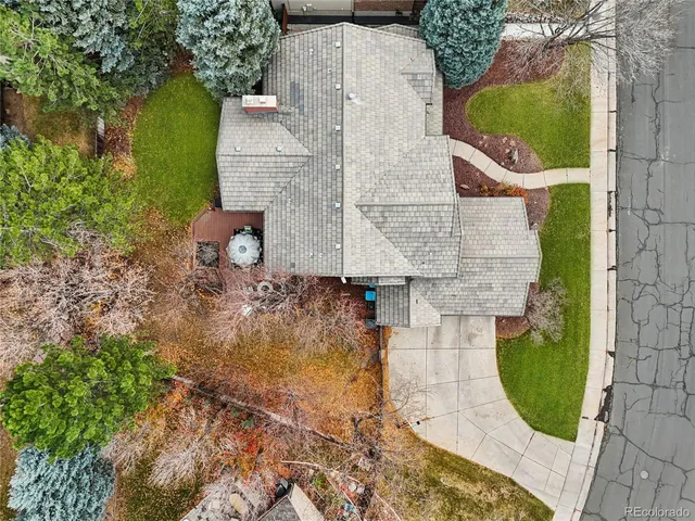 an aerial view of residential house with outdoor space and swimming pool