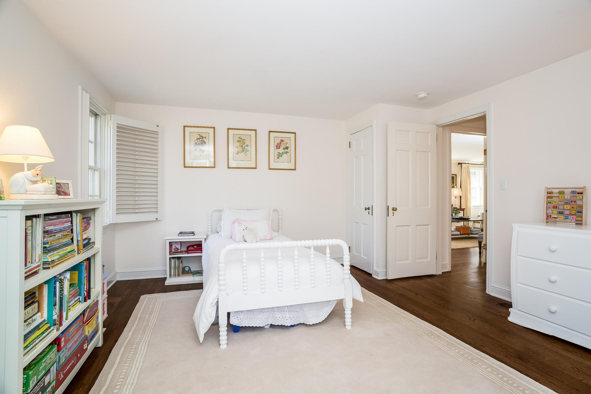 27 Sunset Road Darien, CT 06820 - Photo 16 of 41 a bedroom with a bed and a book shelf