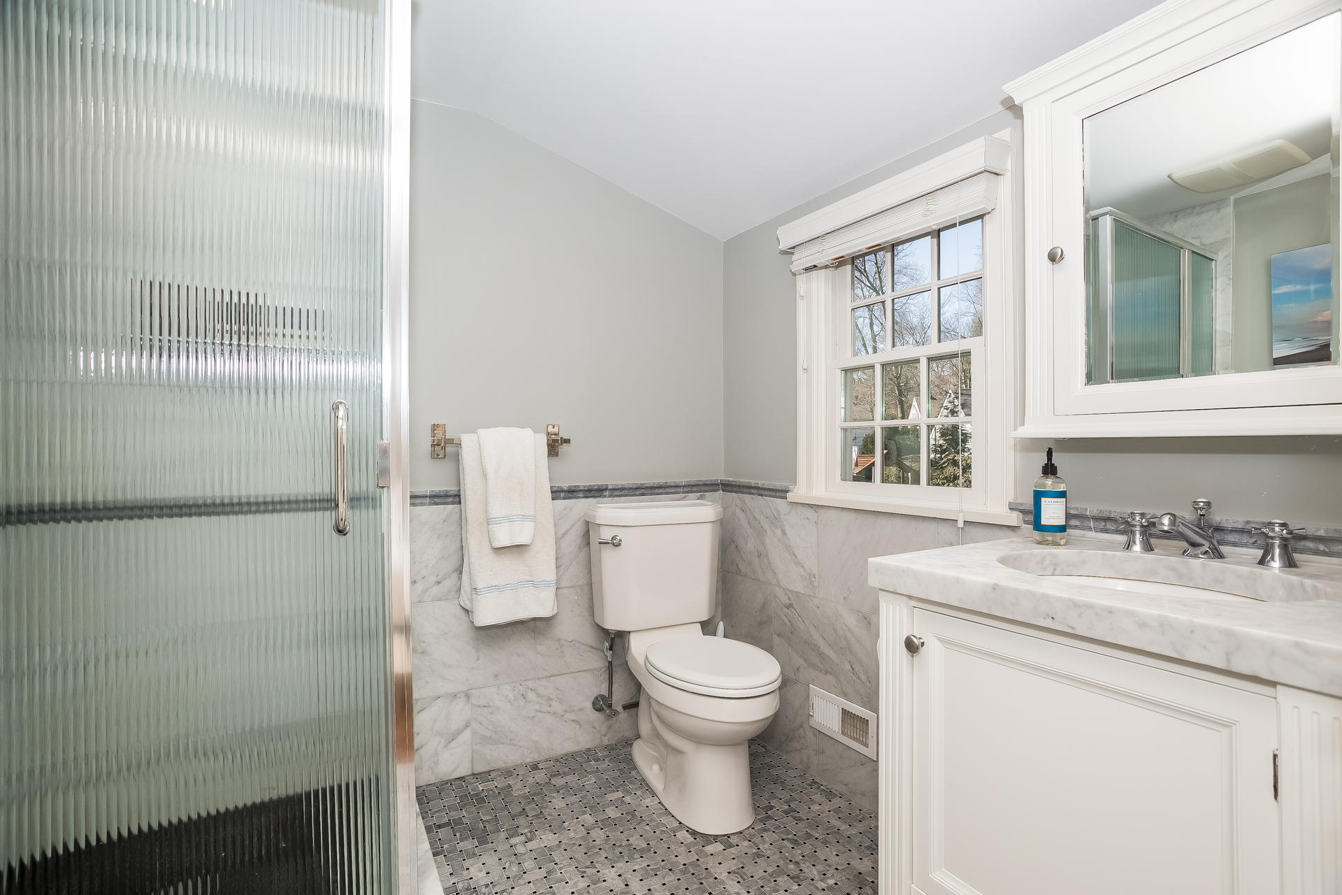 27 Sunset Road Darien, CT 06820 - Photo 24 of 41 a bathroom with a granite countertop toilet sink and mirror