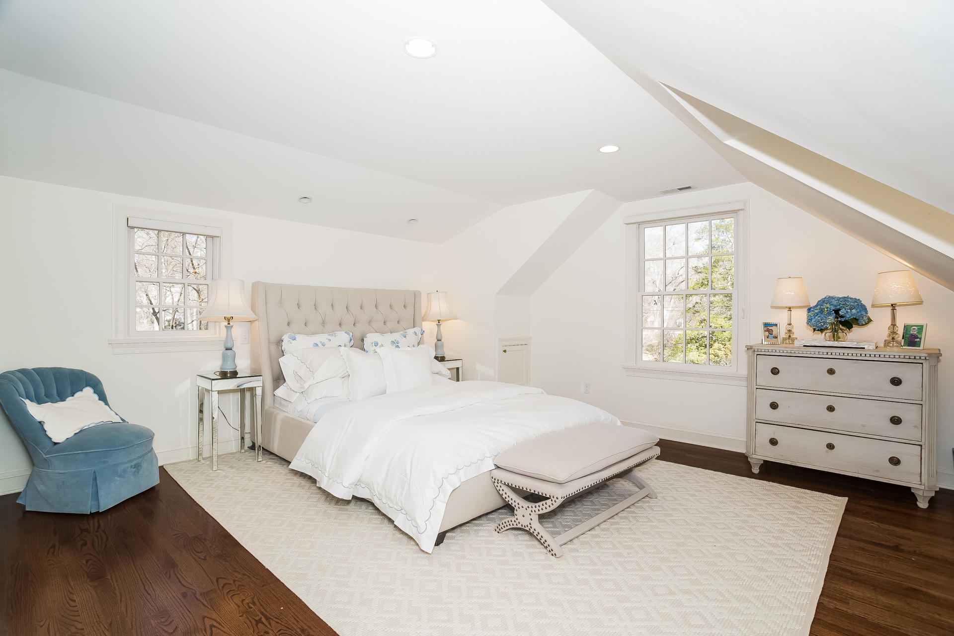 27 Sunset Road Darien, CT 06820 - Photo 25 of 41 a bedroom with a bed and wooden floor