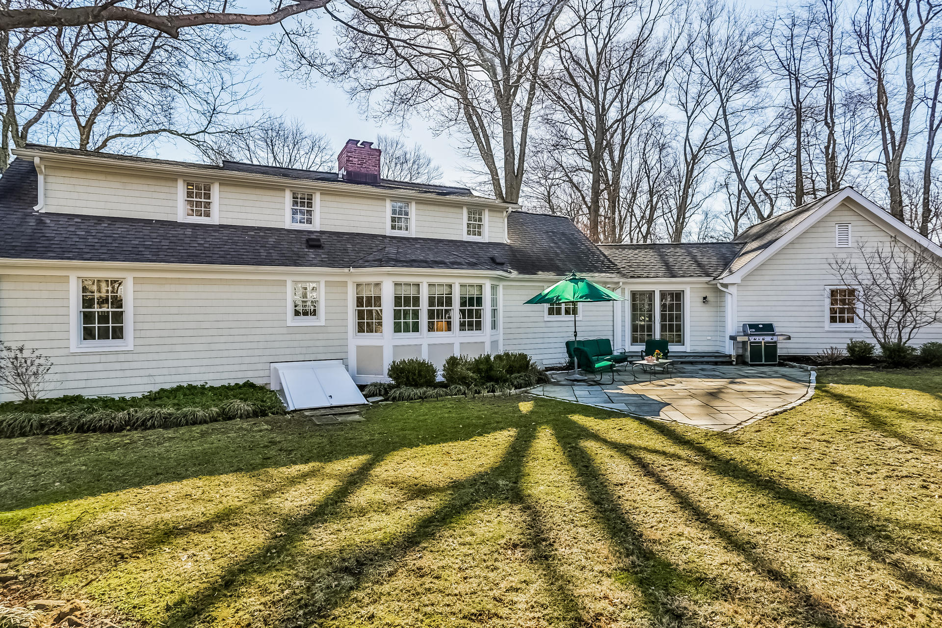 27 Sunset Road Darien, CT 06820 - Photo 33 of 41 a view of a house with swimming pool and a yard