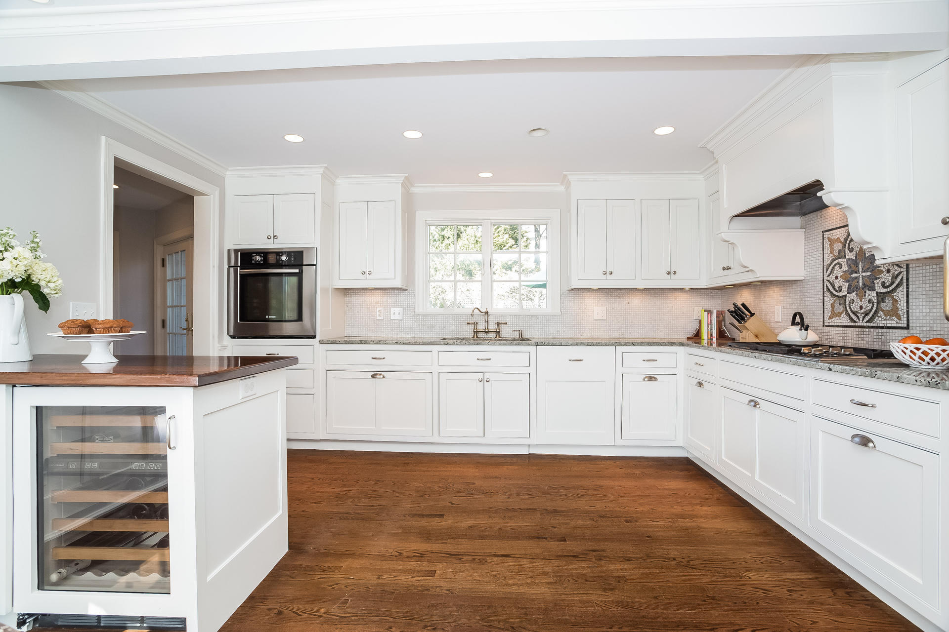 27 Sunset Road Darien, CT 06820 - Photo 6 of 41 a kitchen with kitchen island granite countertop a sink cabinets and stainless steel appliances