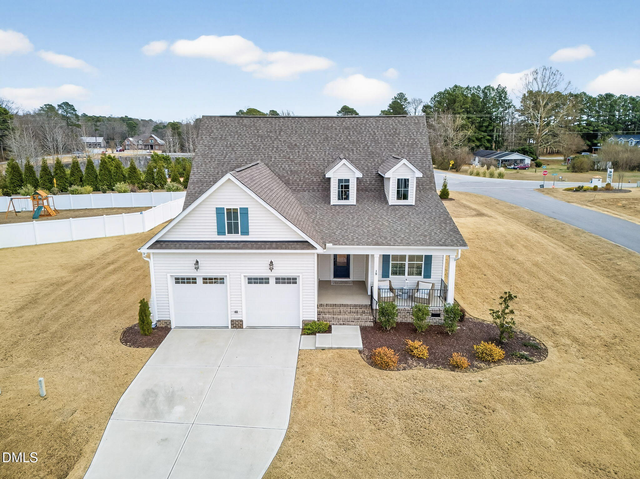a view of house with yard and ocean view