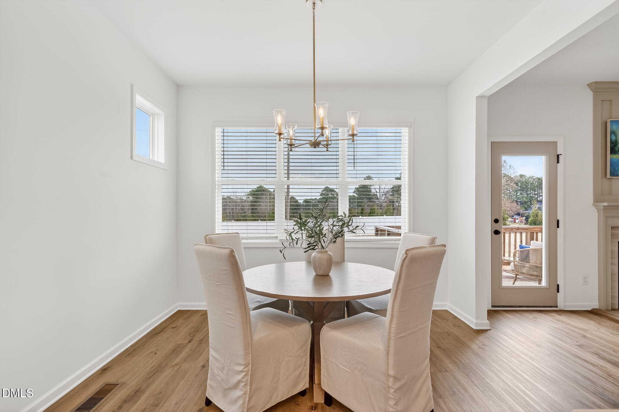 18 North Bream Court Angier, NC 27501 - Photo 11 of 49 a view of a dining room with furniture window and wooden floor