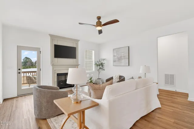 a living room with furniture fireplace and a flat screen tv