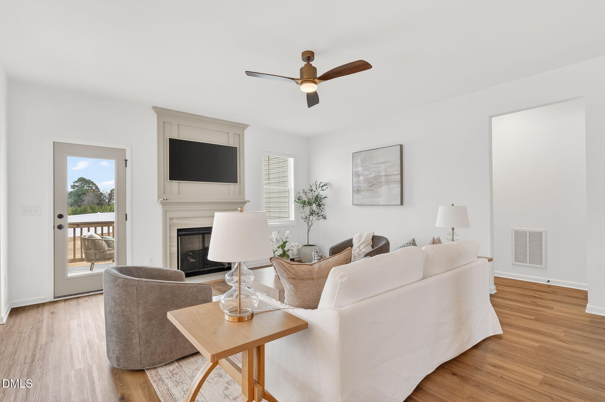 18 North Bream Court Angier, NC 27501 - Photo 13 of 49 a living room with furniture fireplace and a flat screen tv