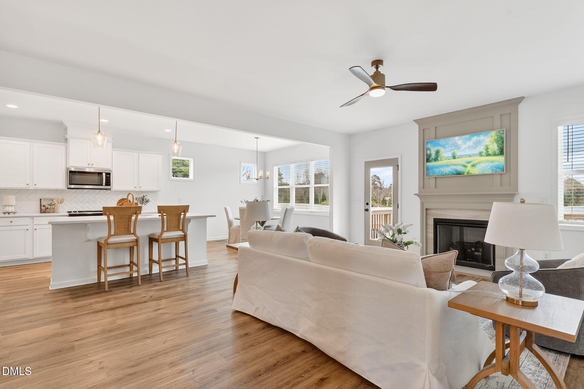 18 North Bream Court Angier, NC 27501 - Photo 15 of 49 a living room with furniture a fireplace and a flat screen tv