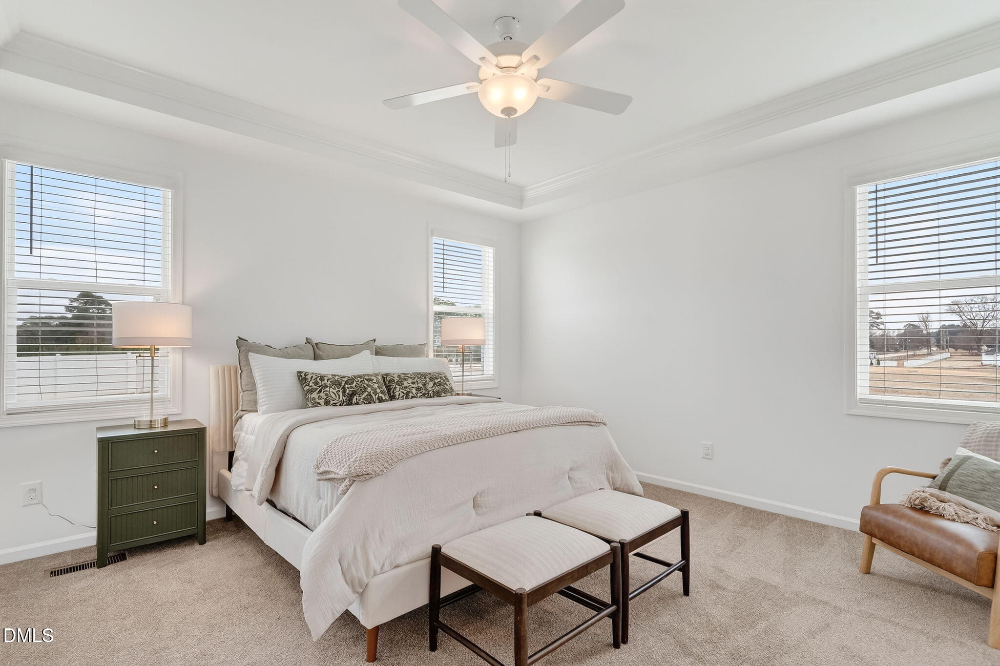 18 North Bream Court Angier, NC 27501 - Photo 16 of 49 a bedroom with a bed a couch and a chandelier