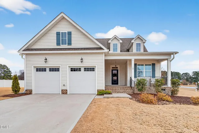 a view of a white house with a outdoor space